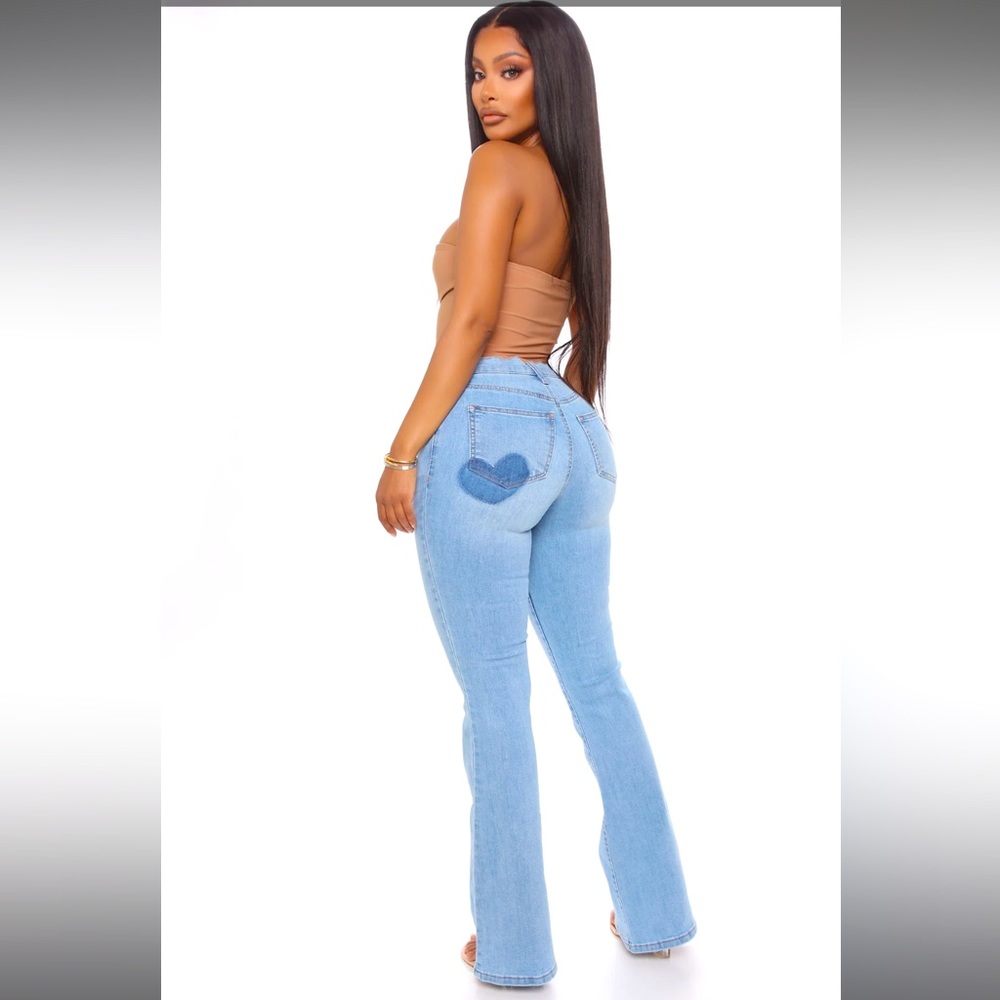 Medium wash flare jeans with heart on back pocket